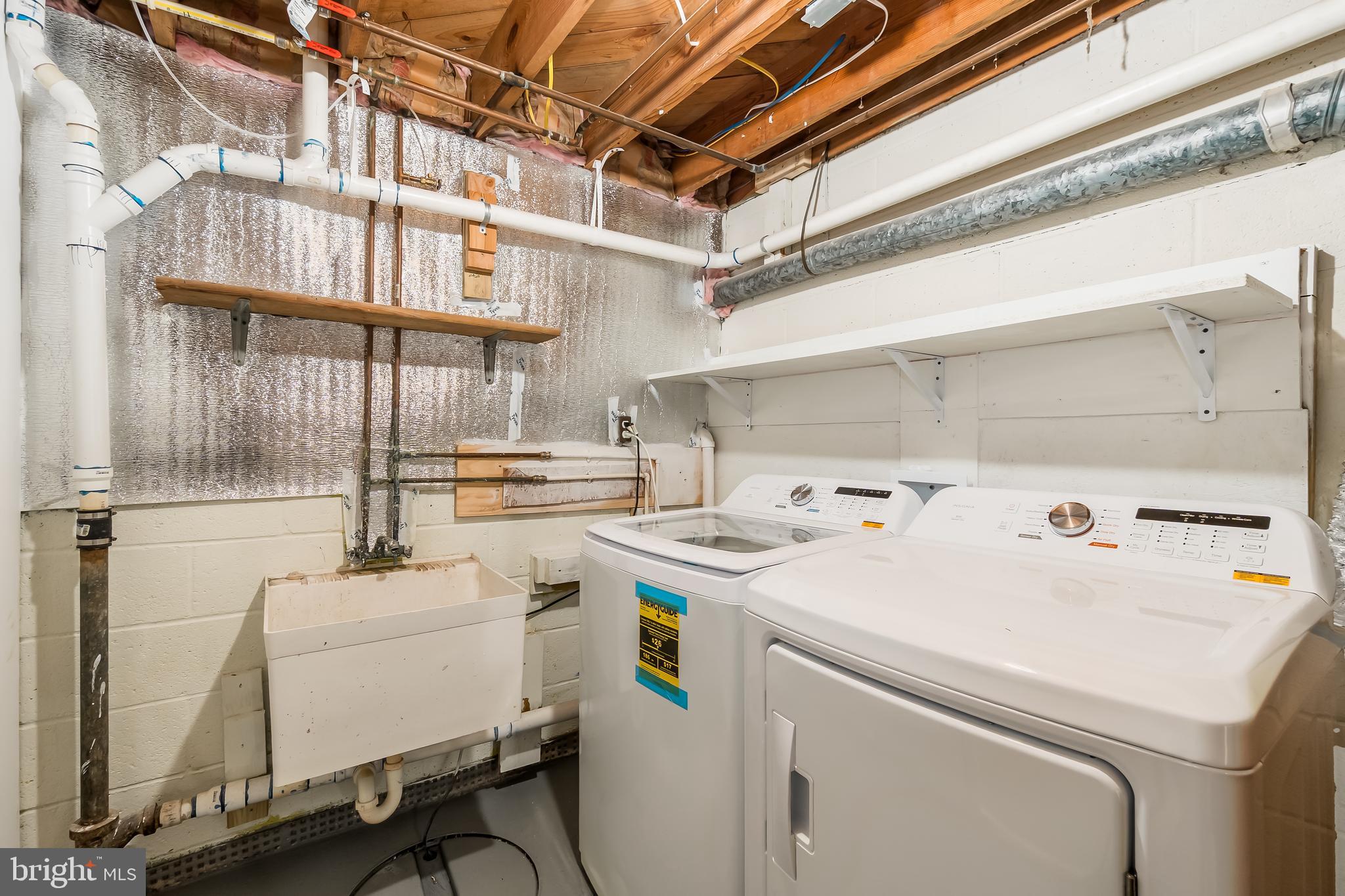 10319 Bethesda Church Road Damascus, MD 20872 - Photo 31 of 41 a utility room with dryer and washer