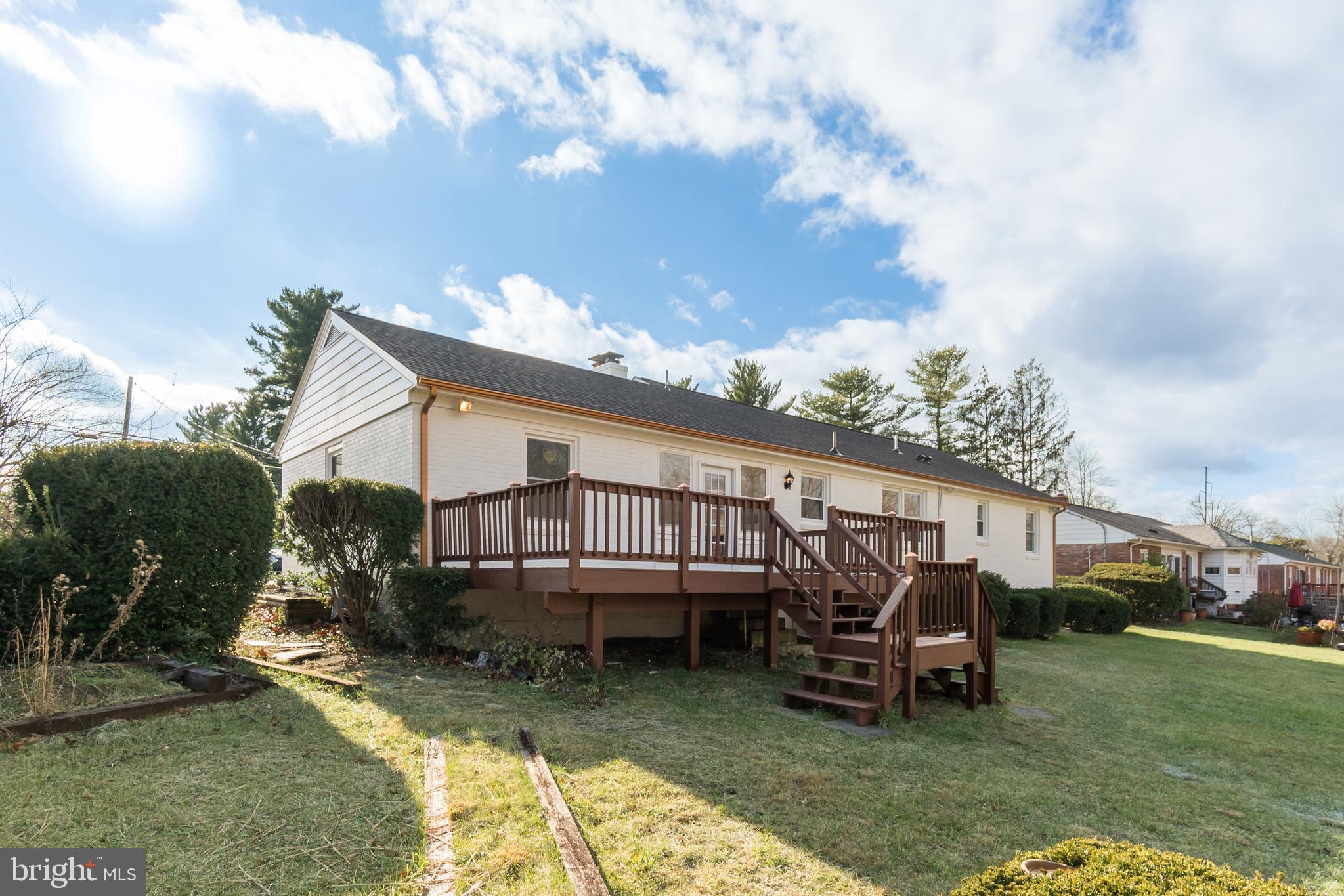 10319 Bethesda Church Road Damascus, MD 20872 - Photo 34 of 41 a backyard of a house with barbeque oven table and chairs