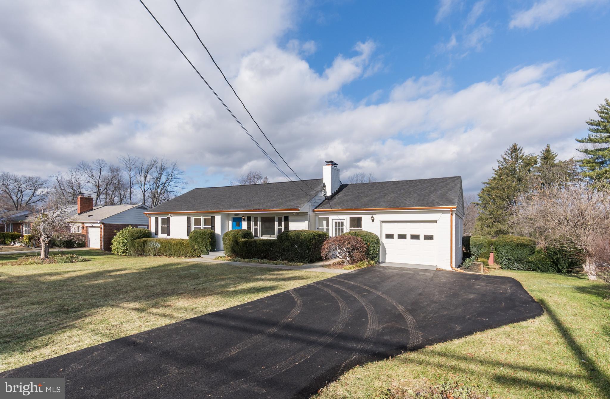 10319 Bethesda Church Road Damascus, MD 20872 - Photo 38 of 41 a front view of a house with a yard