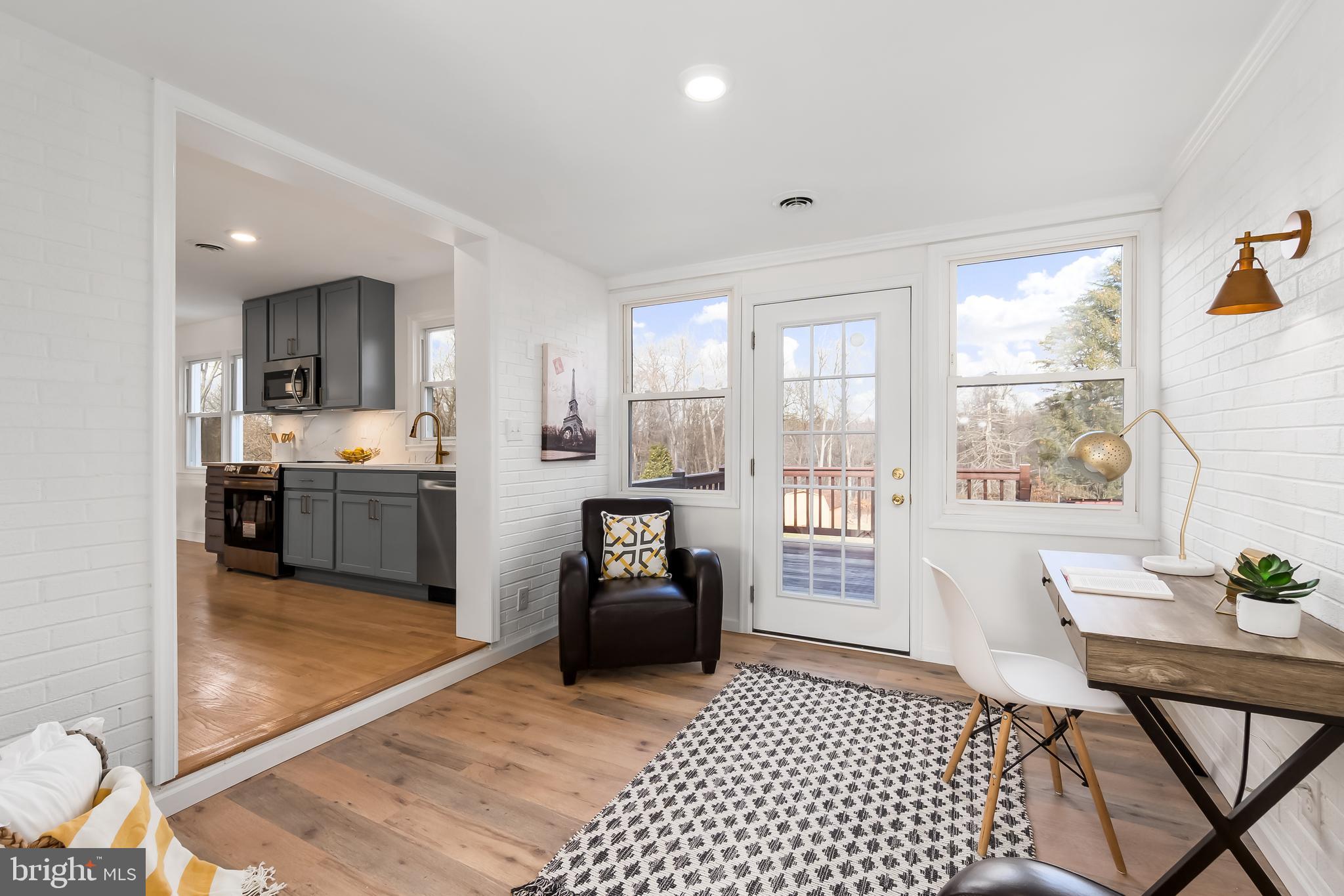 10319 Bethesda Church Road Damascus, MD 20872 - Photo 8 of 41 a living room with furniture and a table