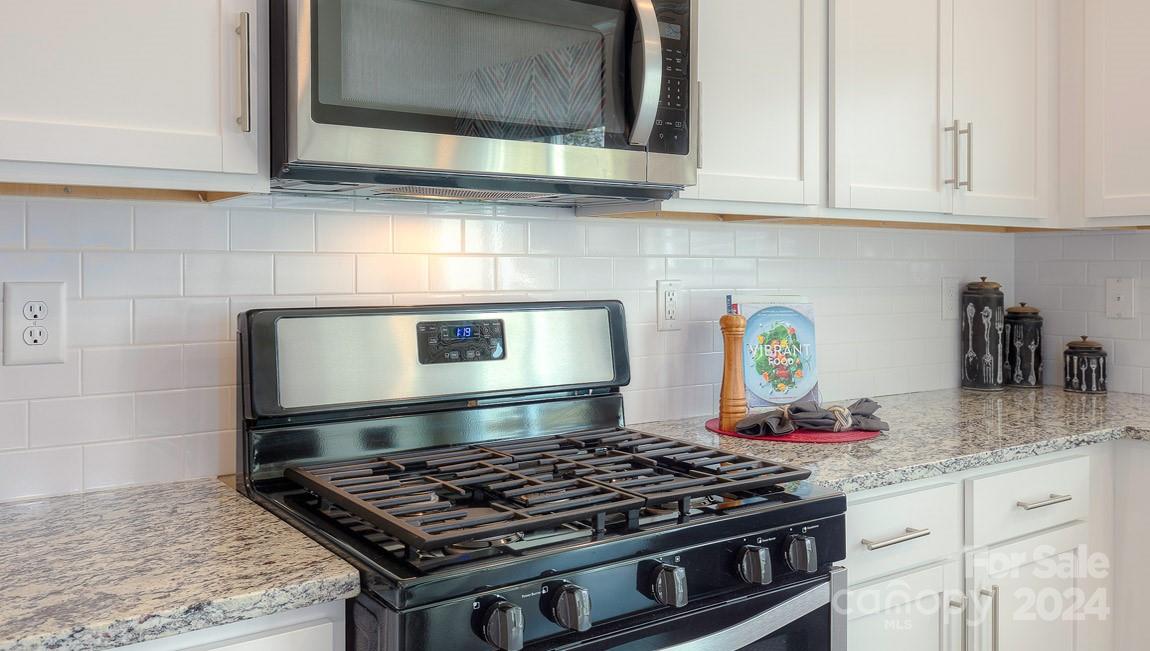 3627 Azalea Rdg Drive Mount Holly, NC 28120 - Photo 12 of 34 a stove top oven sitting inside of a kitchen