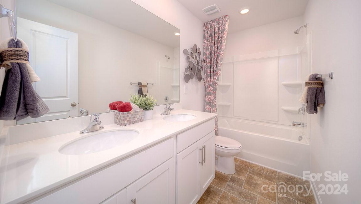 3627 Azalea Rdg Drive Mount Holly, NC 28120 - Photo 13 of 34 a bathroom with a sink a toilet and shower