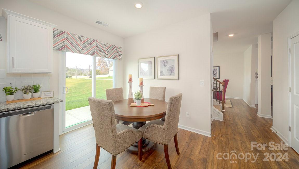 3627 Azalea Rdg Drive Mount Holly, NC 28120 - Photo 20 of 34 a view of a dining room with furniture window and wooden floor