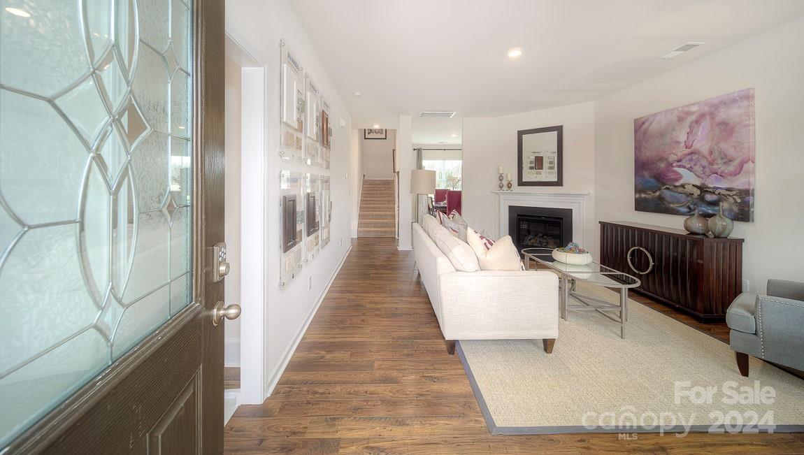 3627 Azalea Rdg Drive Mount Holly, NC 28120 - Photo 2 of 34 a living room with furniture and a fireplace