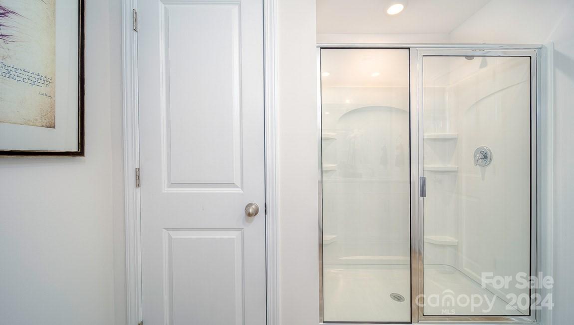 3627 Azalea Rdg Drive Mount Holly, NC 28120 - Photo 26 of 34 a bathroom with a glass shower door