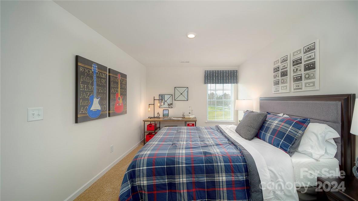 3627 Azalea Rdg Drive Mount Holly, NC 28120 - Photo 30 of 34 a bedroom with a bed and window