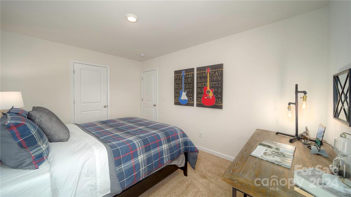 3627 Azalea Rdg Drive Mount Holly, NC 28120 - Photo 31 of 34 a bedroom with a bed and a window
