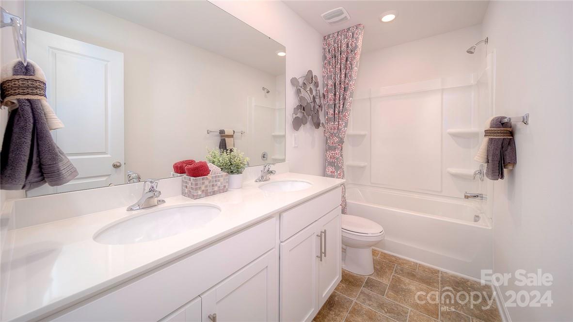3627 Azalea Rdg Drive Mount Holly, NC 28120 - Photo 32 of 34 a bathroom with a sink a toilet and shower