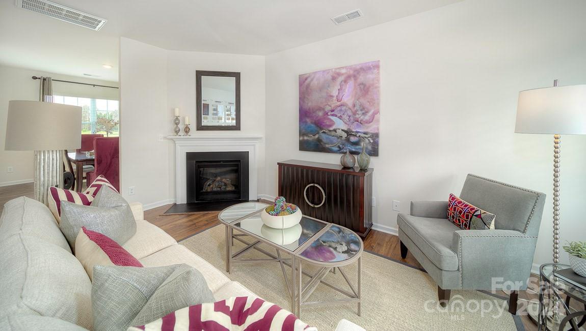 3627 Azalea Rdg Drive Mount Holly, NC 28120 - Photo 4 of 34 a living room with furniture and a fireplace