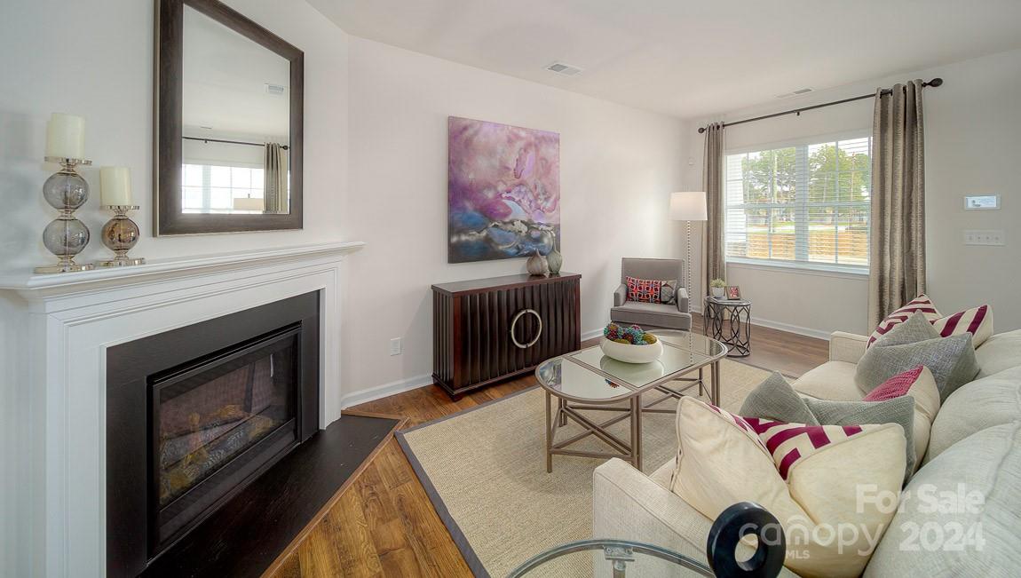 3627 Azalea Rdg Drive Mount Holly, NC 28120 - Photo 5 of 34 a living room with furniture and a fireplace