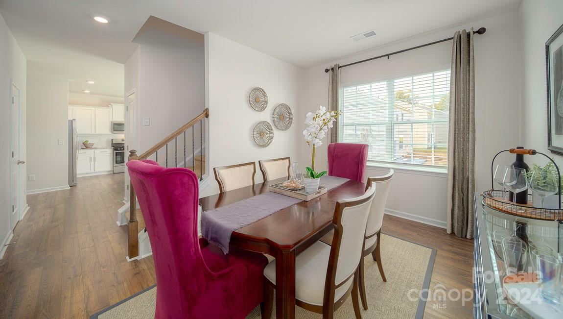 3627 Azalea Rdg Drive Mount Holly, NC 28120 - Photo 8 of 34 a view of a dining room with furniture window and wooden floor