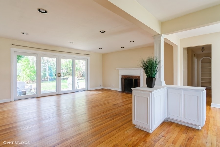 314 Wagner Road Northfield, IL 60093 - Photo 5 of 17 a view of a livingroom with a fireplace and wooden floor