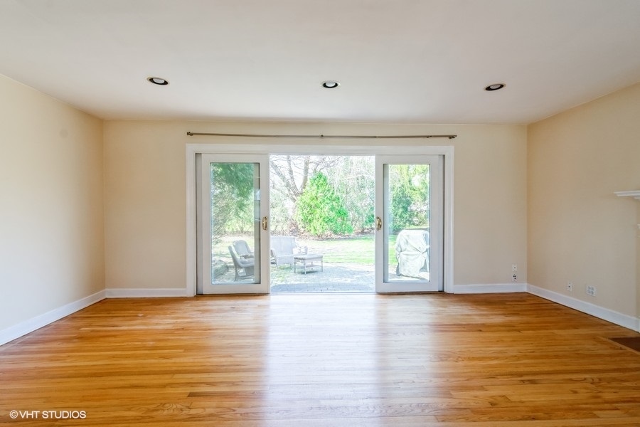 314 Wagner Road Northfield, IL 60093 - Photo 7 of 17 a view of a room with wooden floor and window