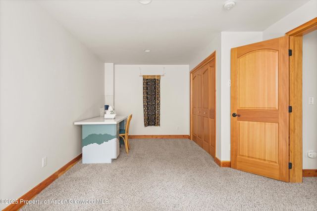 a view of a livingroom with wooden floor and a sink