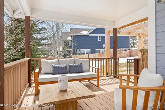 a living room with large windows