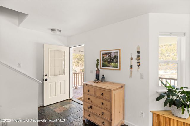 a view of a bedroom with wooden floor and closet