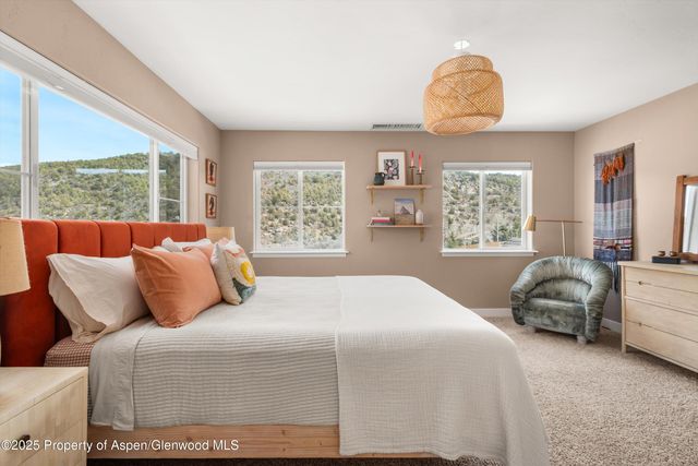 a bedroom with bed and window