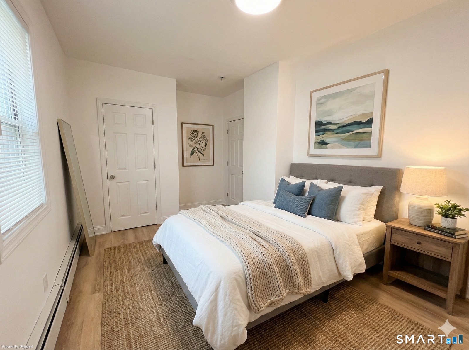 98 Franklin Avenue, Unit 1 Hartford, CT 06114 - Photo 6 of 7 a bedroom with a bed and a painting on the wall