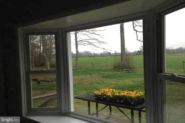 a view of a two chairs in the porch