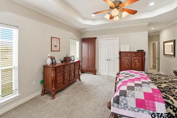 a bedroom with furniture and a window