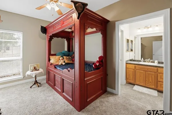 a bed room with a bed and a chandelier