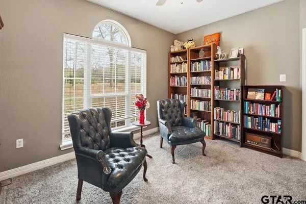 a spacious bathroom with a double vanity sink and mirror