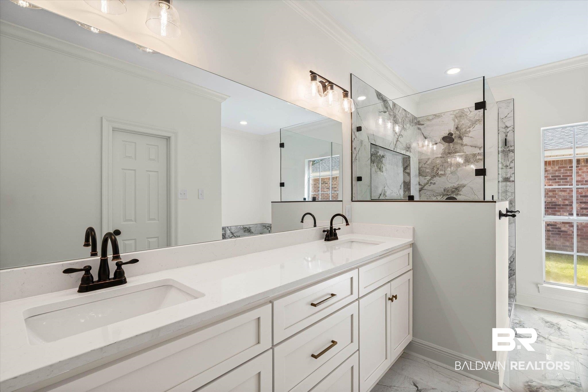 3451 Lacoste Road Mobile, AL 36618 - Photo 20 of 36 Full bath with ornamental molding, double vanity, a marble finish shower, light marble finish floors, and recessed lighting