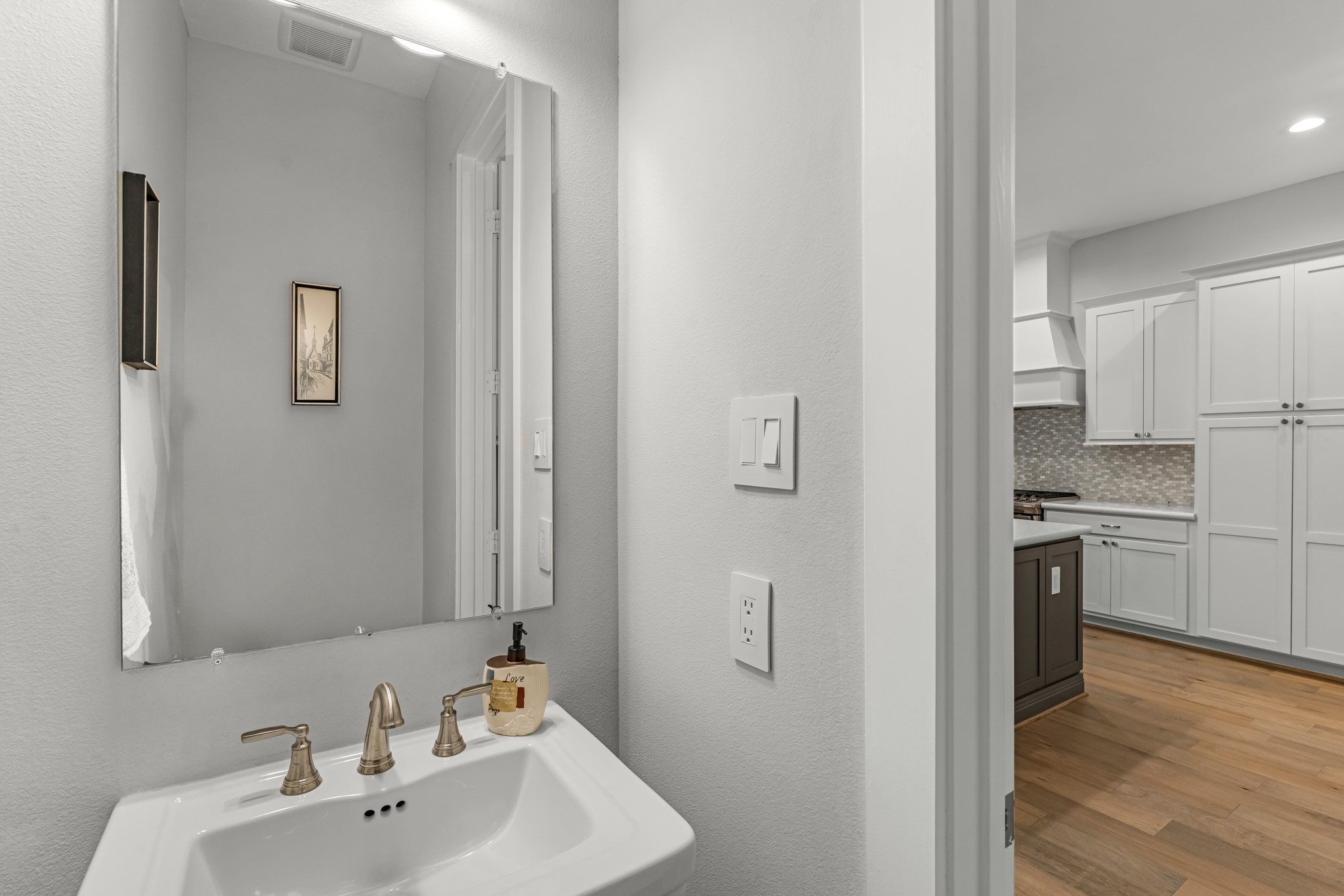 11 Thorpe Lane Spring, TX 77389 - Photo 19 of 34 This charming home features a beautifully appointed half bath adjacent to the family room, perfect for welcoming guests and adding convenience to your daily life.