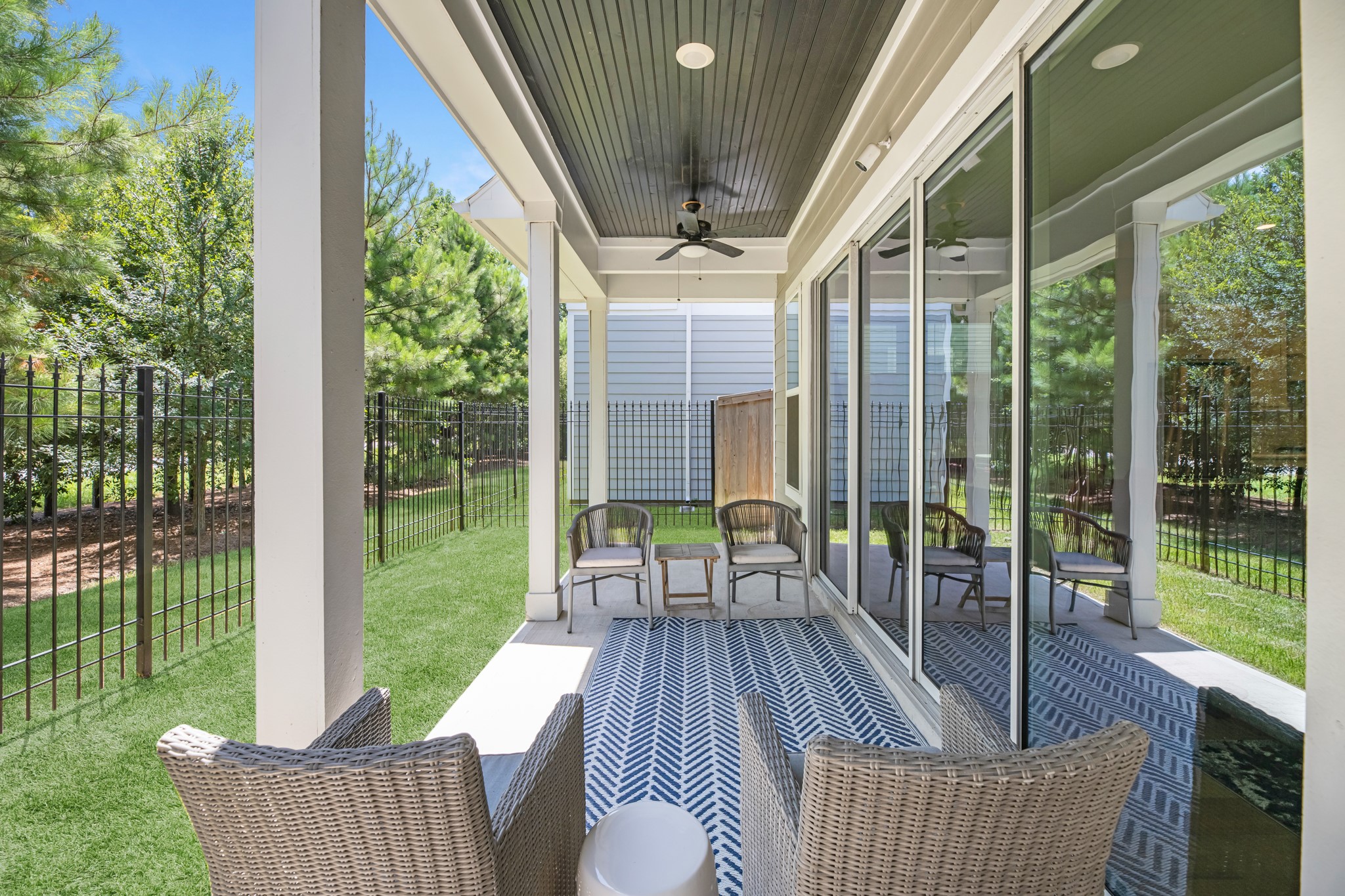 11 Thorpe Lane Spring, TX 77389 - Photo 20 of 34 The covered patio is generously sized, providing ample space for various outdoor activities.