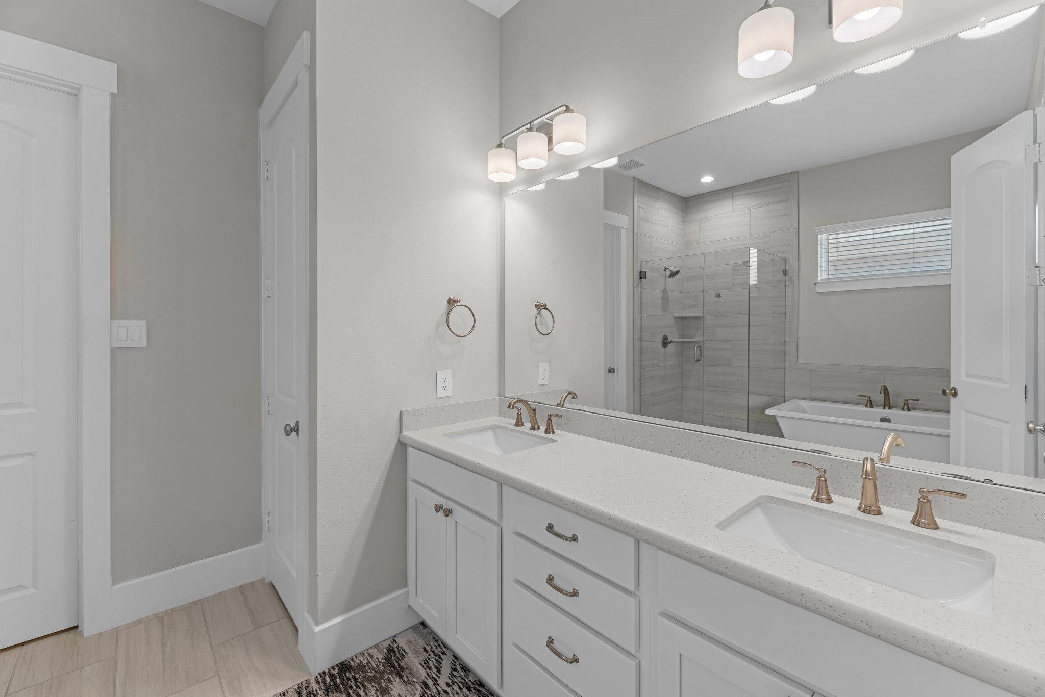 11 Thorpe Lane Spring, TX 77389 - Photo 26 of 34 The en-suite bathroom offers a spa-like atmosphere with its elegant design, high end finishes, and tasteful lighting, creating a retreat within your own home.