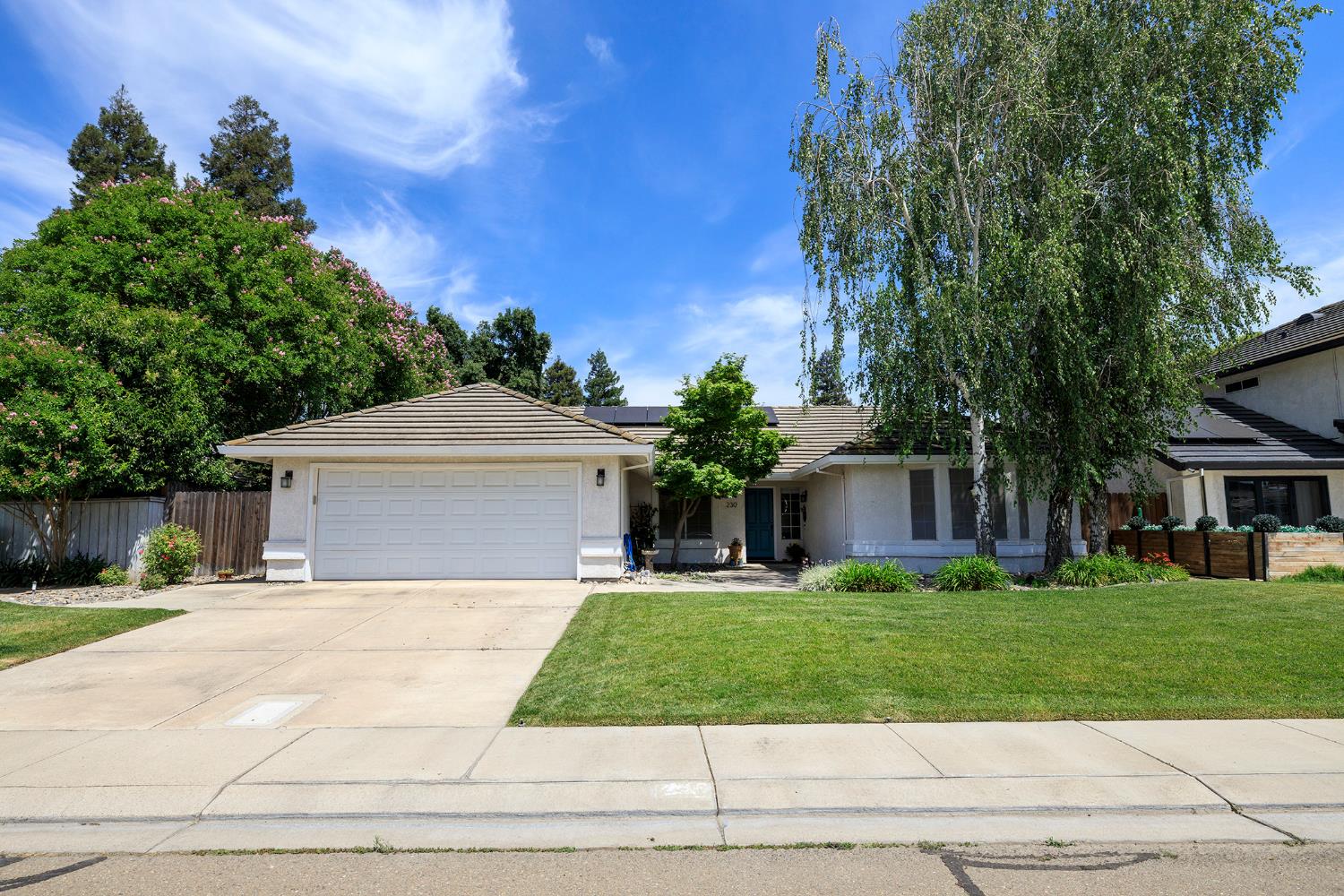 230 Meyenberg Avenue Ripon, CA 95366 - Photo 1 of 52 a front view of house with yard and green space