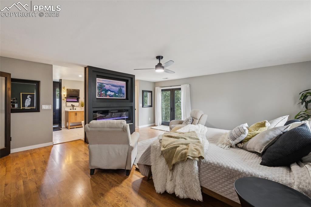 17940 Appaloosa Road Monument, CO 80132 - Photo 15 of 44 a bedroom with bed and a couch