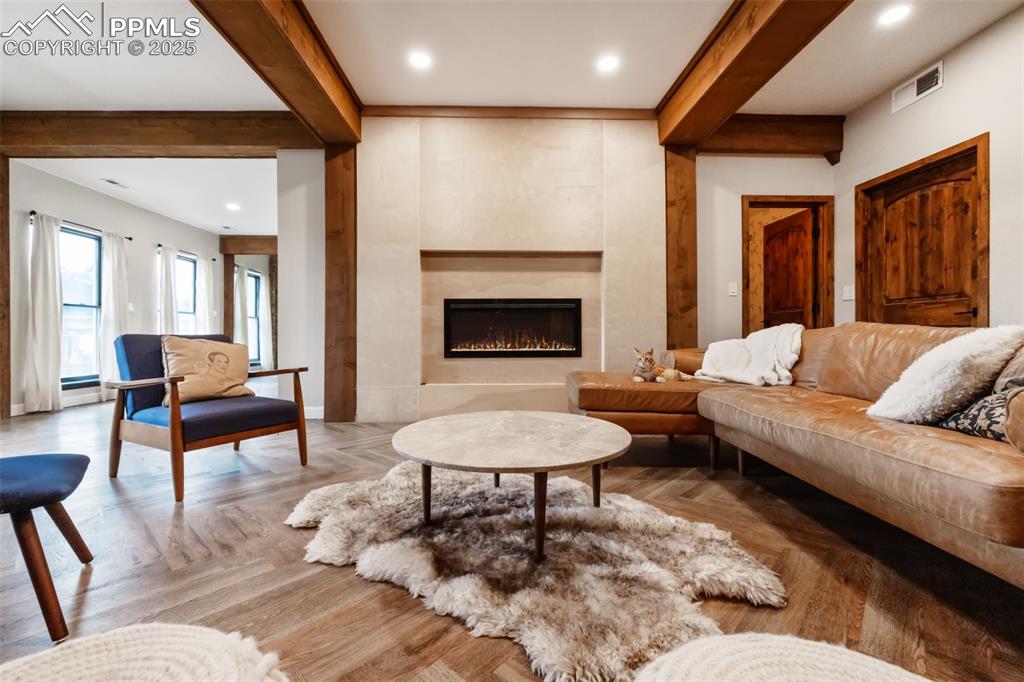 17940 Appaloosa Road Monument, CO 80132 - Photo 2 of 44 a living room with furniture and a fireplace