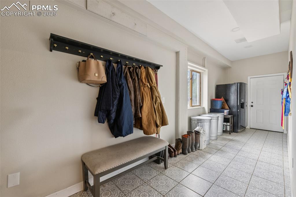 17940 Appaloosa Road Monument, CO 80132 - Photo 29 of 44 a view of walk in closet with clothes and shoes