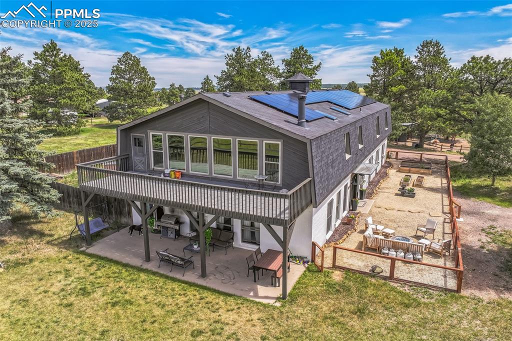 17940 Appaloosa Road Monument, CO 80132 - Photo 35 of 44 a view of a house with roof deck front of house