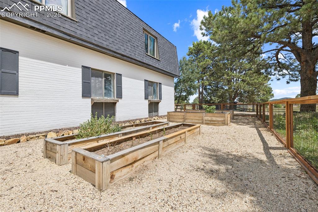 17940 Appaloosa Road Monument, CO 80132 - Photo 36 of 44 a view of a house with backyard and sitting area