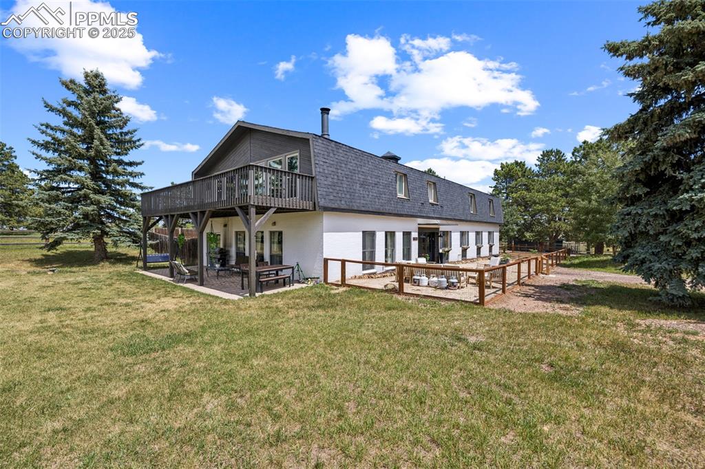 17940 Appaloosa Road Monument, CO 80132 - Photo 39 of 44 a view of a house with swimming pool and sitting area