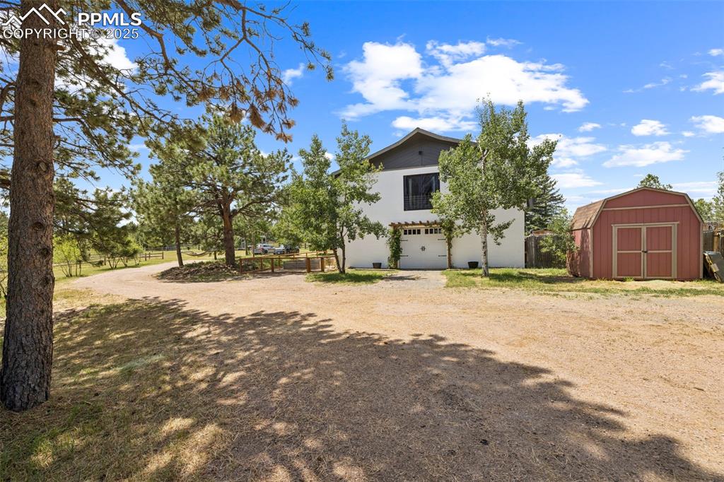 17940 Appaloosa Road Monument, CO 80132 - Photo 4 of 44 a view of a house with snow on the road