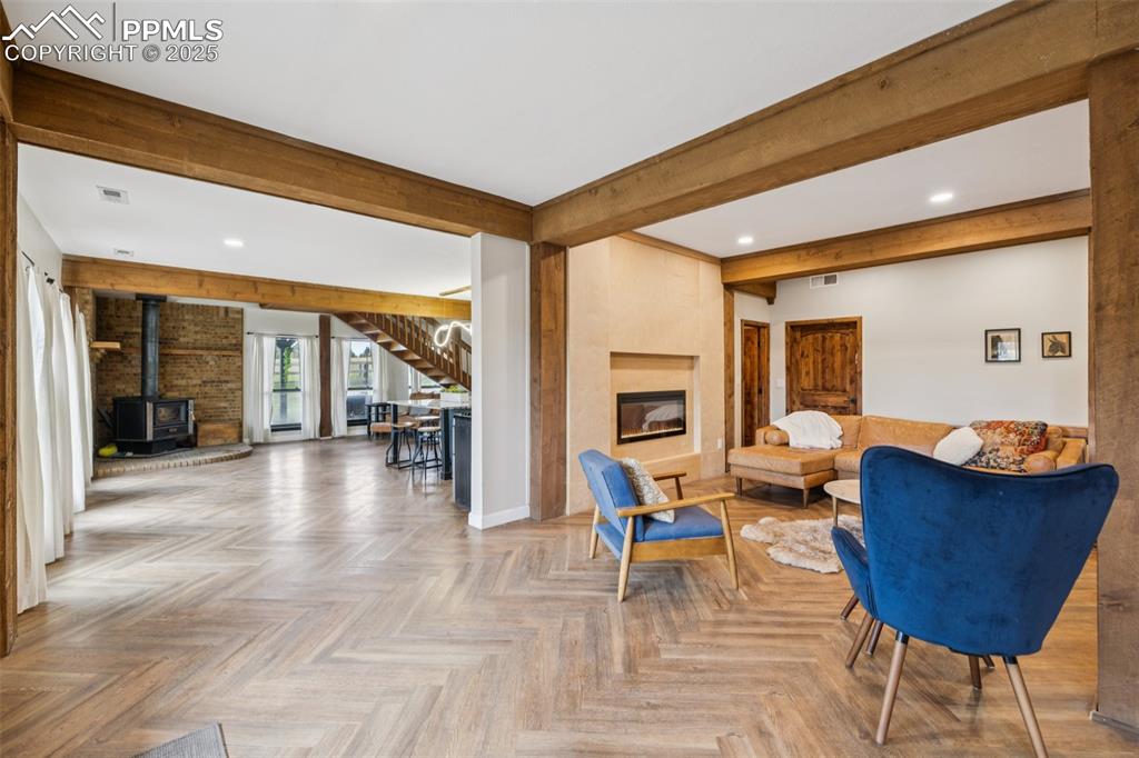 17940 Appaloosa Road Monument, CO 80132 - Photo 6 of 44 a living room with furniture a rug and a window