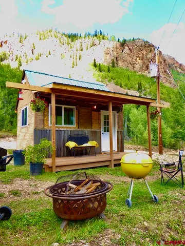 a kitchen with stainless steel appliances granite countertop a refrigerator and a stove