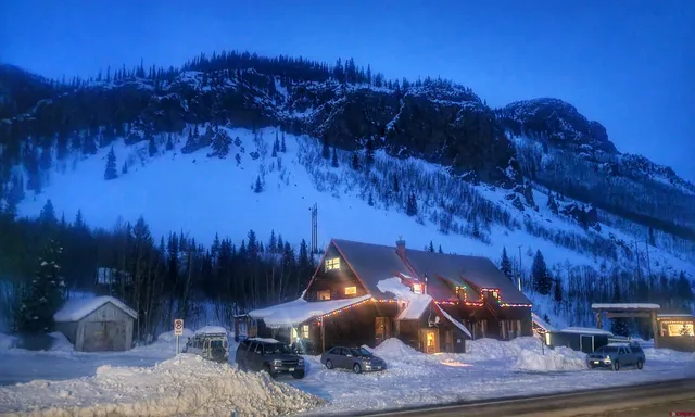 a view of group of people sitting in front of house