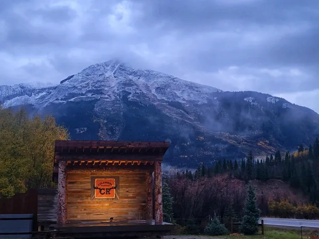 a balcony with table and chairs