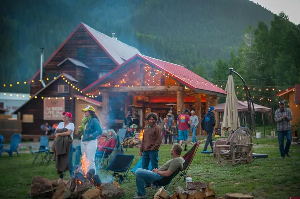 a dining room with furniture and a fireplace