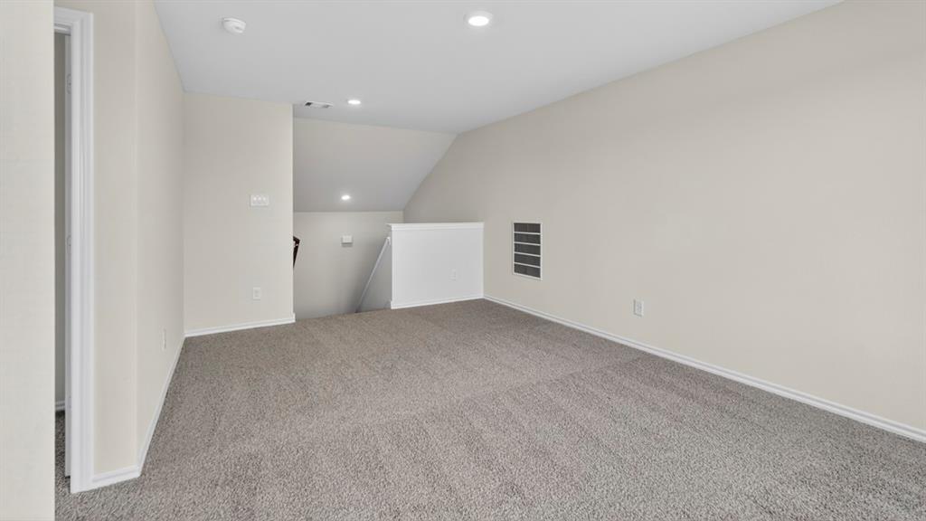 4008 Ripplewood Drive Lindale, TX 75771 - Photo 15 of 37 Versatile loft space featuring neutral carpeting, light-toned walls, and recessed lighting