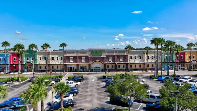 a view of water heater room with wooden floor