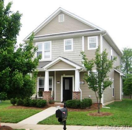 8825 Washam Potts Road Cornelius, NC 28031 - Photo 1 of 3 a front view of a house with a yard and trees