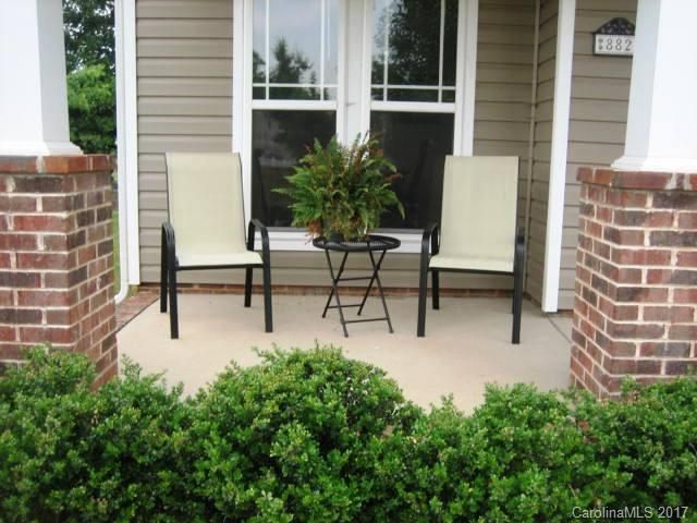 8825 Washam Potts Road Cornelius, NC 28031 - Photo 2 of 3 a view of a patio with chairs and potted plants