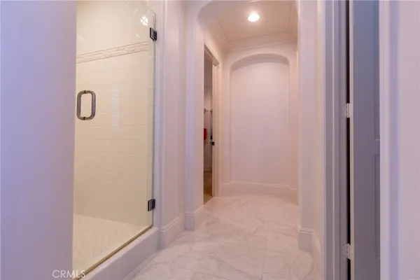 a bathroom with a glass shower door