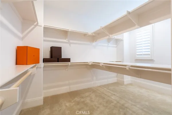 a view of a kitchen with a sink and a window