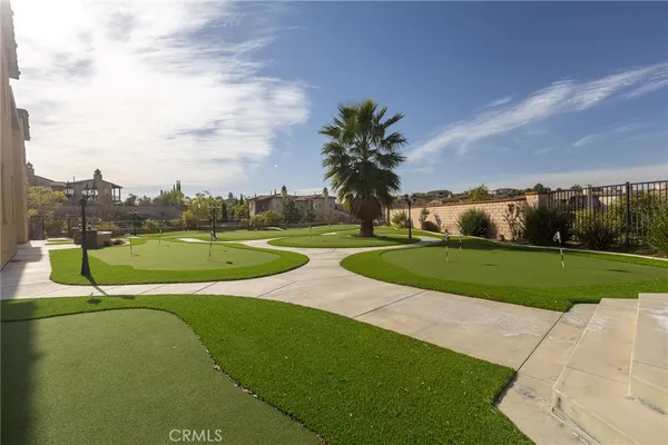 a view of a swimming pool and a yard